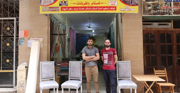 men standing outside shop