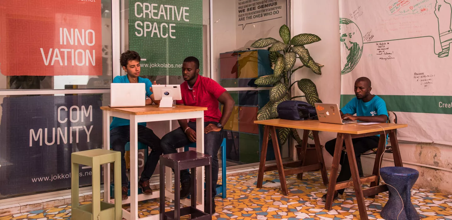 Three young entrepreneurs in a coworking space in Dakar, Senegal