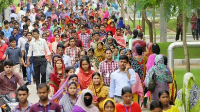 Garment employees are seen leaving a clothing plant at the end of their working day in Bangladesh.