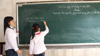 A student and her teacher in primary school